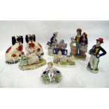 Group of Staffordshire pottery models and figures, to include: a pair of spaniels, a sailor and