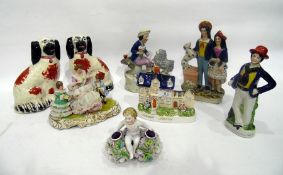 Group of Staffordshire pottery models and figures, to include: a pair of spaniels, a sailor and