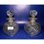 Pair Victorian gilt clear decanters each with wrythen spherical stopper, gilt borders and wrythen