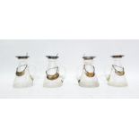 Four similar miniature glass jugs with silver rims and lids, each bearing silver bottle labels marke