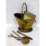 Antique brass embossed coal scuttle with half-hood, floral repousse and sundry tools