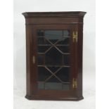 A 19th century mahogany wall-hanging astragal-glazed doored corner cabinet