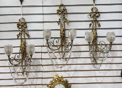 Three gilt metal and glass double-branch wall light brackets with ribbon and foliate decoration,