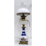 Victorian painted opaque glass and brass oil lamp converted to electricity, having cut glass clear