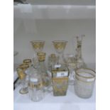 Gilt and clear liqueur ewer, scrolling foliate decorated, three matching stemmed liqueur glasses,