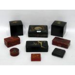 Pair square black laquer papiermache boxes, the lids decorated with cranes and a quantity of