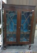 19th century mahogany display cabinet, the astragal-glazed doors enclosing shelves, to cabriole