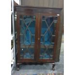 19th century mahogany display cabinet, the astragal-glazed doors enclosing shelves, to cabriole