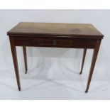 A 19th century mahogany tea table, the fold-over top above single drawer, on reeded tapering