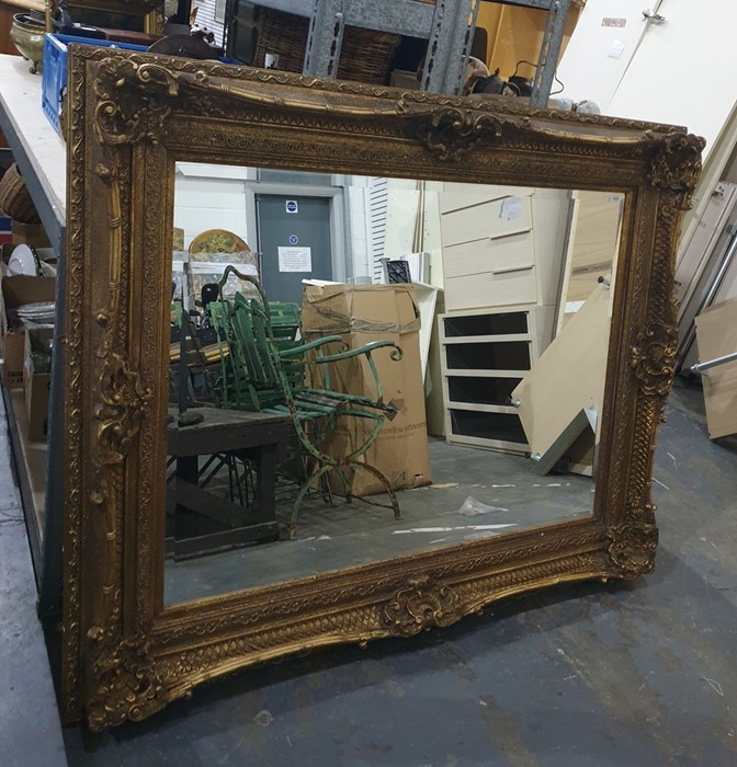 A 20th century rectangular bevel edged wall mirror in moulded gilt gesso effect frame, 165cm x 132cm