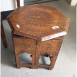 An Eastern octagonal and inlaid folding table, 36cm