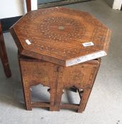An Eastern octagonal and inlaid folding table, 36cm