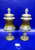 Pair gilt cover pedestal jars, each with pointed finial, cushion shape cover, panelled waisted body,