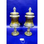 Pair gilt cover pedestal jars, each with pointed finial, cushion shape cover, panelled waisted body,