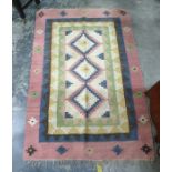 Cream ground rug with pale pink and green lattice decoration, 151cm x 111cm and a cream ground rug