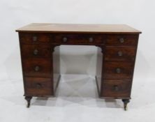 A 19th century mahogany pedestal desk of nine assorted drawers, to turned feet and castors, 104cm