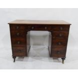 A 19th century mahogany pedestal desk of nine assorted drawers, to turned feet and castors, 104cm