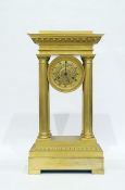 Regency gilt brass four pillar clock having dentil and egg and dart pediment, the gilt movement with