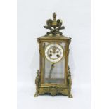 French gilt brass four glass clock, having vase, scroll, flaming torch and quiver surmount, the