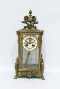 French gilt brass four glass clock, having vase, scroll, flaming torch and quiver surmount, the