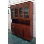 A 20th century Oriental rosewood dresser with four glazed doors enclosing shelves, above base of