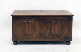20th century oak blanket chest, the plain lift top above two linenfold panels to the front, 90cm x