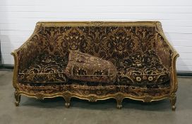 Late 19th/early 20th century gilt gesso three-piece suite viz:- three-seater settee with floral