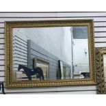 Gilt rectangular wall mirror together with another mirror.