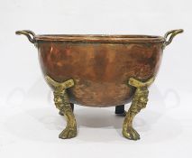 Large copper and brass two handled log pan, the copper pan having pair brass loop handles and raised