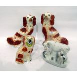 Pair Victorian Staffordshire spaniels with iron-red markings, another and a Victorian