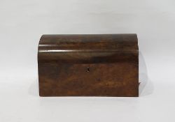 Burr walnut dome-top tea caddy opening to reveal three-section interior