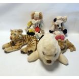 Steiff tiger, a Merrythought seal pyjama case, a Wendy Boston clown, a badger, a small tiger and a