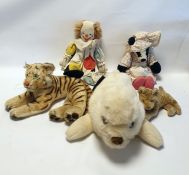 Steiff tiger, a Merrythought seal pyjama case, a Wendy Boston clown, a badger, a small tiger and a