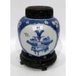 Oriental blue and white porcelain ginger jar decorated with panels of vases on blue and white prunus