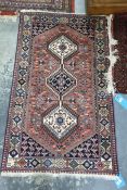 Reproduction Persian style wool rug with three hooked lozenge medallions in shades of blue, cream