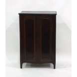 19th century mahogany two-door cabinet enclosing shelves, raised upon square section supports,