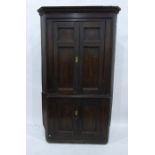 Late Georgian pine floor-standing corner cupboard with greek key cornice, the upper section with two