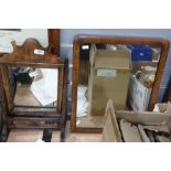 Small toilet mirror and another wood framed mirror