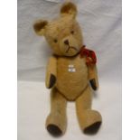 A large plush bear, stitched nose and mouth, glass eyes some repairs 81cm approximately