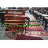 Miniature barrel organ and cart by Vicente Llinares, marked 'Saventia, Barcelona', painted in red