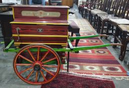 Miniature barrel organ and cart by Vicente Llinares, marked 'Saventia, Barcelona', painted in red