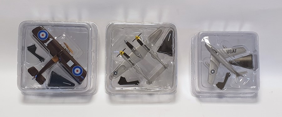 Collection of model airplanes in plastic boxes