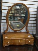19th century mahogany dressing table mirror, the oval mirror above serpentine fronted box of three
