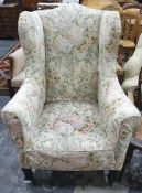 19th century wing back armchair in loose foliate covers