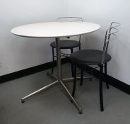 White circular breakfast table and two breakfast chairs (3)