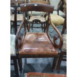 19th century mahogany carver chair with scrolled arms, turned and reeded supports, peg feet and a