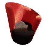 20th century armchair with red upholstered curving back rest and black upholstered seat