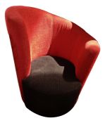 20th century armchair with red upholstered curving back rest and black upholstered seat