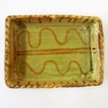 Winchcombe pottery rectangular dish with rope pattern border green glaze wave and line decorated