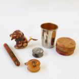 Novelty tape measure shaped as a small dog (damaged), a Mauchlineware needle holder, another